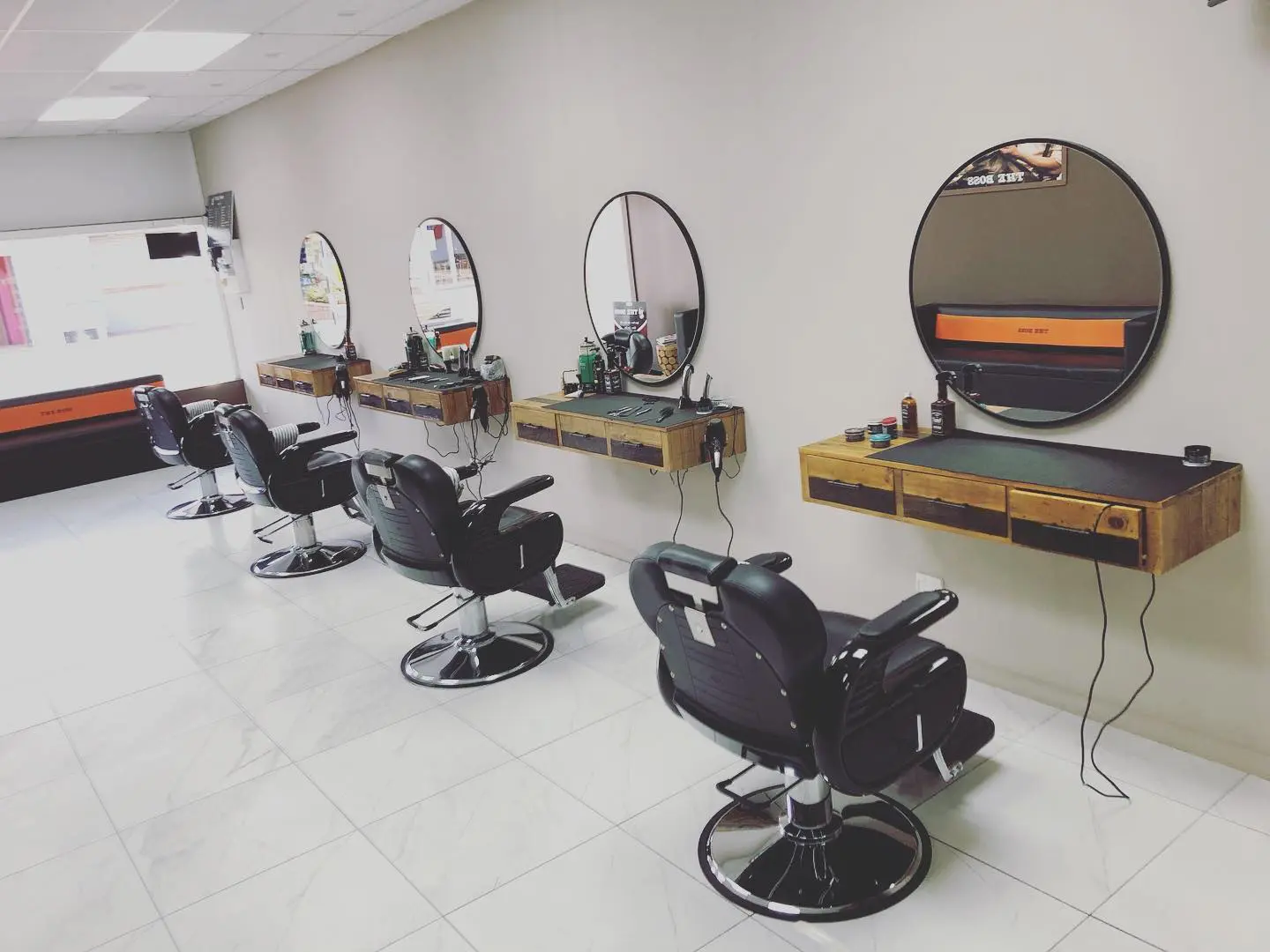 Barber chairs and mirror stations inside The Boss