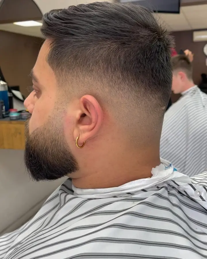 Finished haircut with beard detail and a clean side blend
