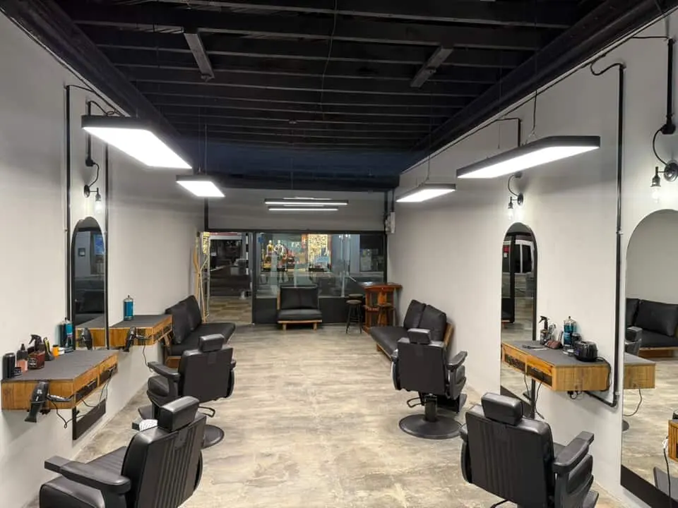 Interior view of The Boss grooming lounge with chairs and mirrors