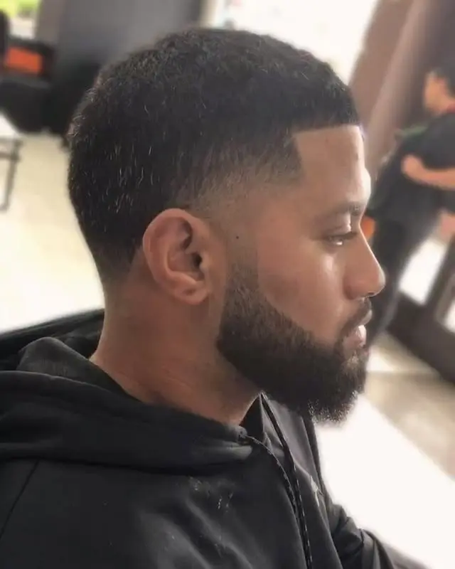 Finished skin fade and beard shape from the side